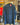 Blue denim jacket with a patch on a hanger in a clothing store.