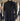 Black coat hanging on a rack with other clothing in the background