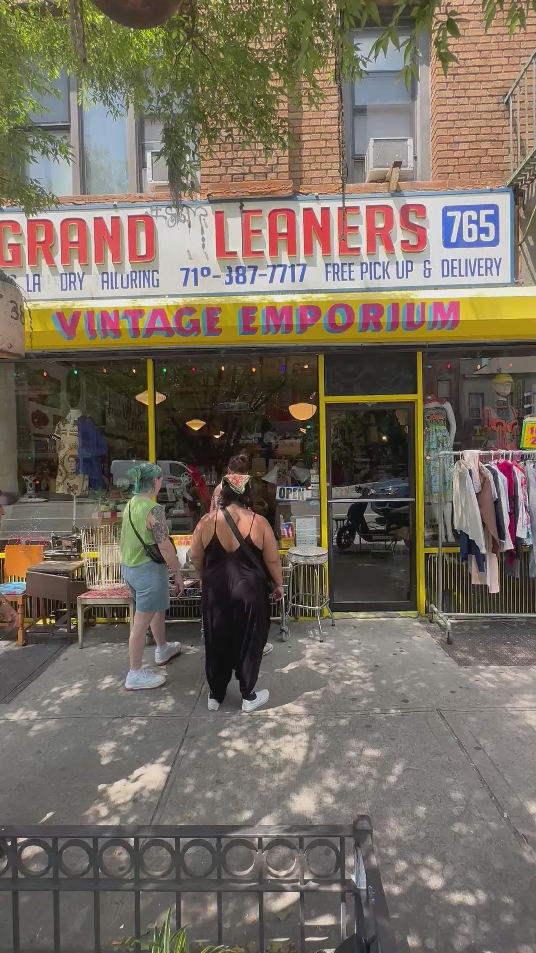 Video showing in front of Grand Leaners store with customers entering and exiting the shop