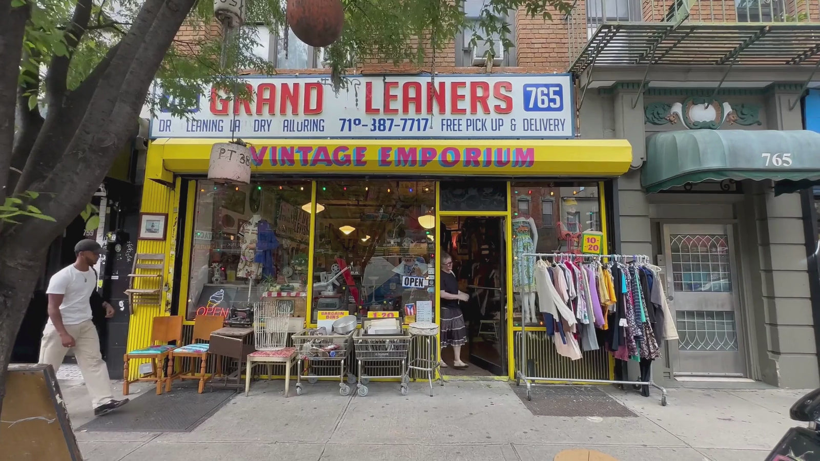 Video showing in front of Grand Leaners store with customers entering and exiting the shop