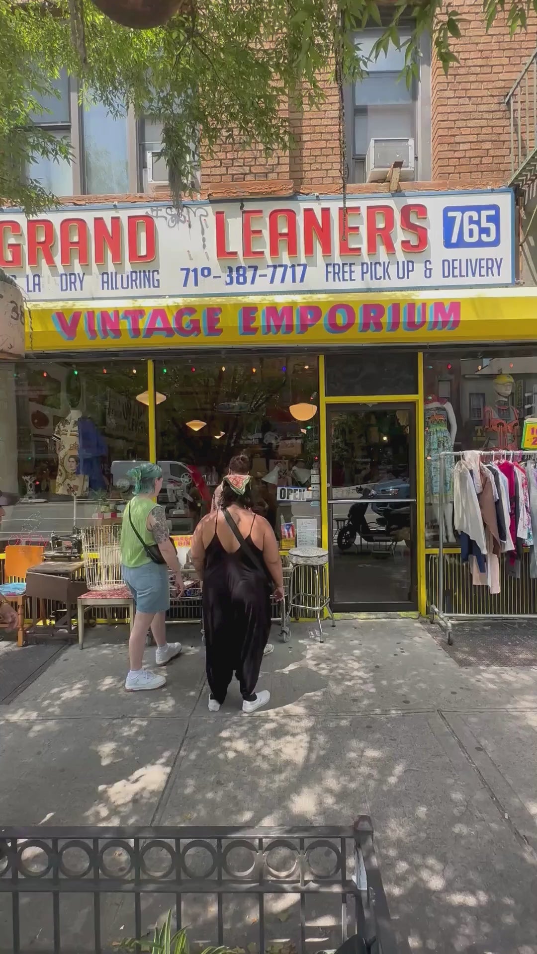 Video showing in front of Grand Leaners store with customers entering and exiting the shop